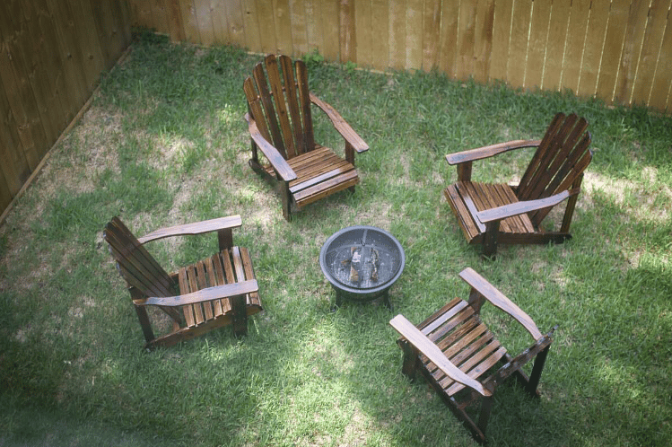 Cozy firepit with four adirondack chairs for cozying up with friends & family on chilly evenings! Pet-friendly with a backyard and privacy fencing! 