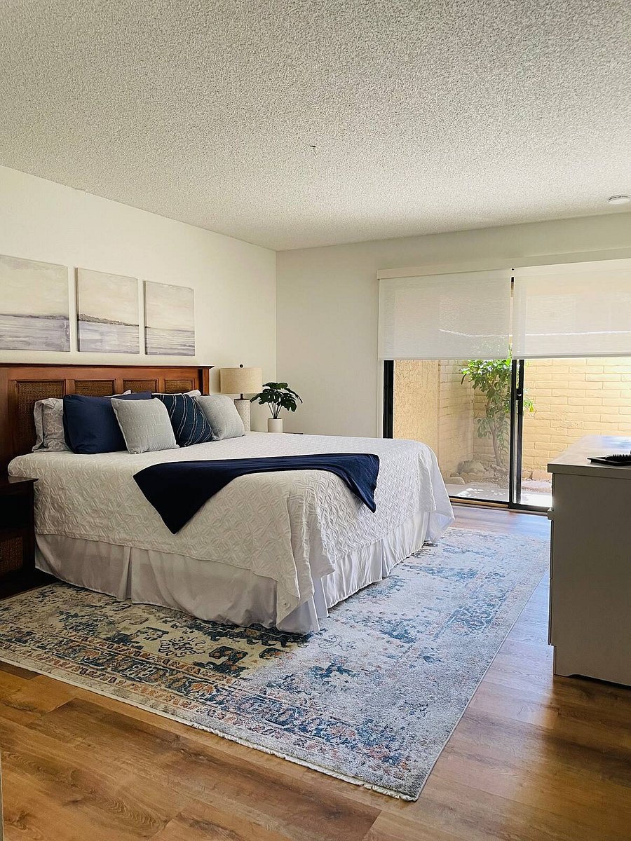 Master bedroom with king sized bed and private patio