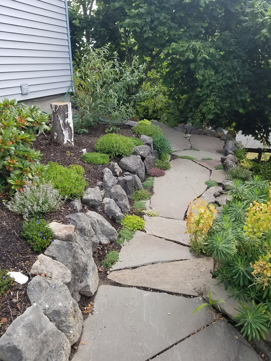 Garden Path to Private Entrance. Blooms vary by season.