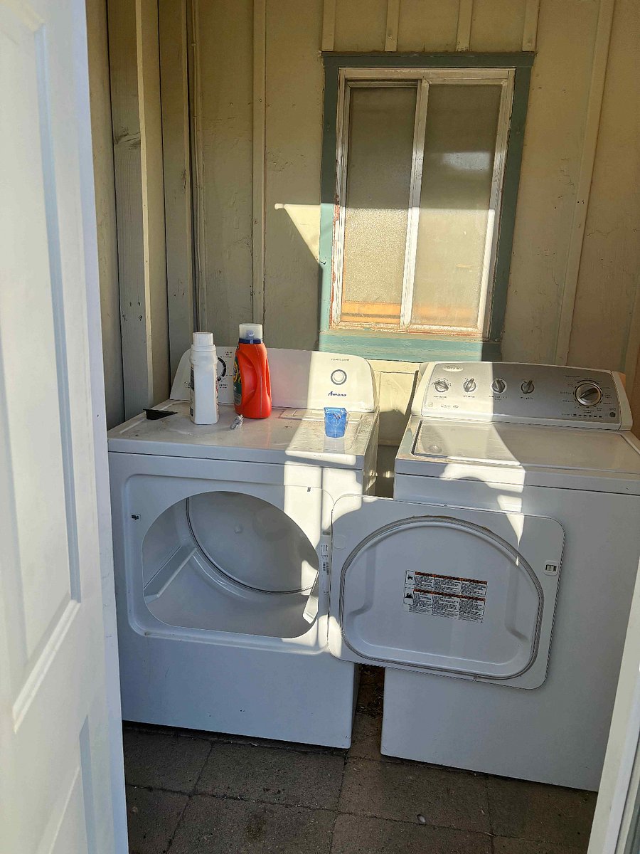 Laundry Area - Full sized washer and dryer located immediately adjacent to side door
