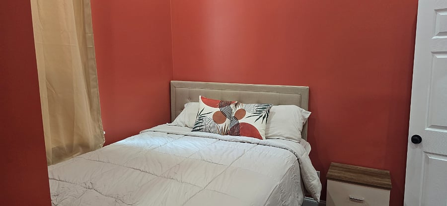 Queen bedroom with closet and wardrobe. 