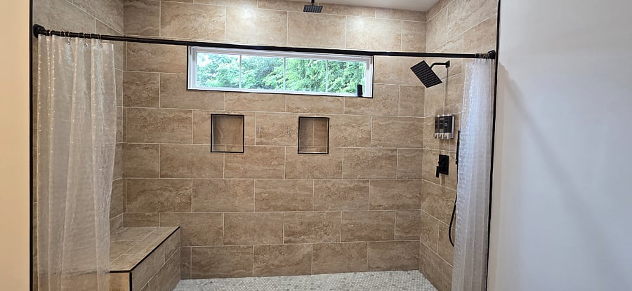 Shower is huge and features rainfall, handheld and standard shower heads. Shampoo, conditioner and soap dispenser. 