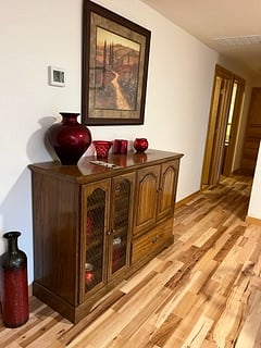 Dining room Buffet, beautiful hickory floor throughout the home.