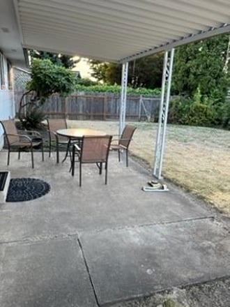 Large fenced Backyard, with covered Patio.