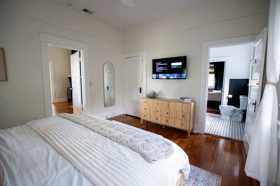 Bedroom 2 with king bed and TV with YouTube, shares a Jack-and-Jill bathroom with bedroom 3
