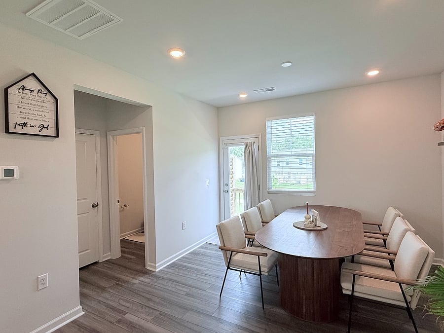 Second floor: Dining room, balcony door, storage closet, and powder bathroom