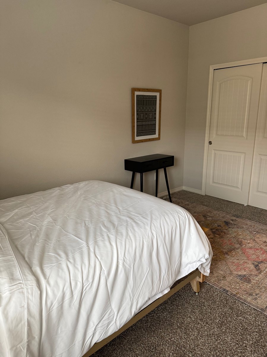 Bedroom with full bed and desk
