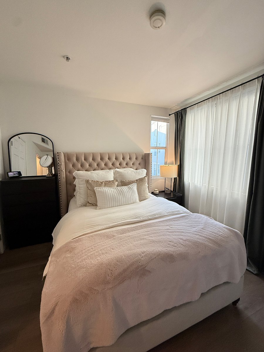Bedroom with blackout shades and curtains. 