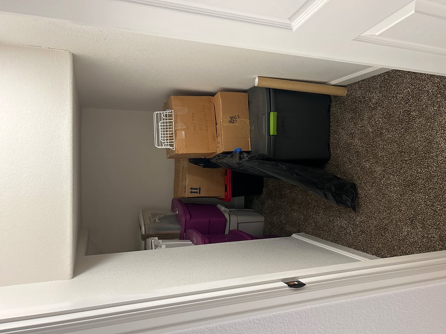 There is a space for storage you can use. We will move out boxes out of the way if you need it!