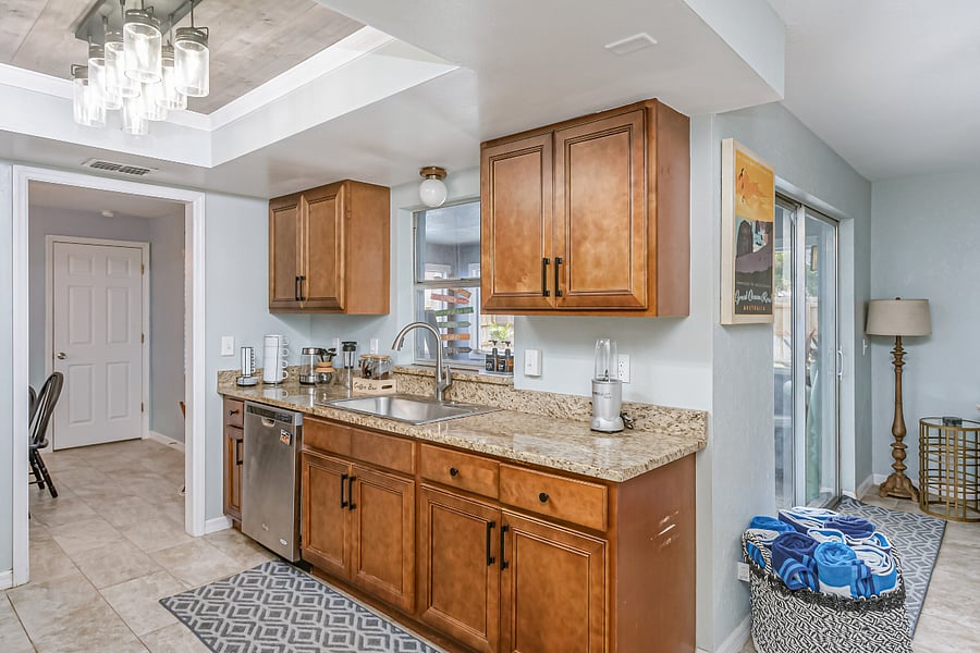 Kitchen Stocked with Dishes, Silverware, Pots, Pans, and a Coffee Station