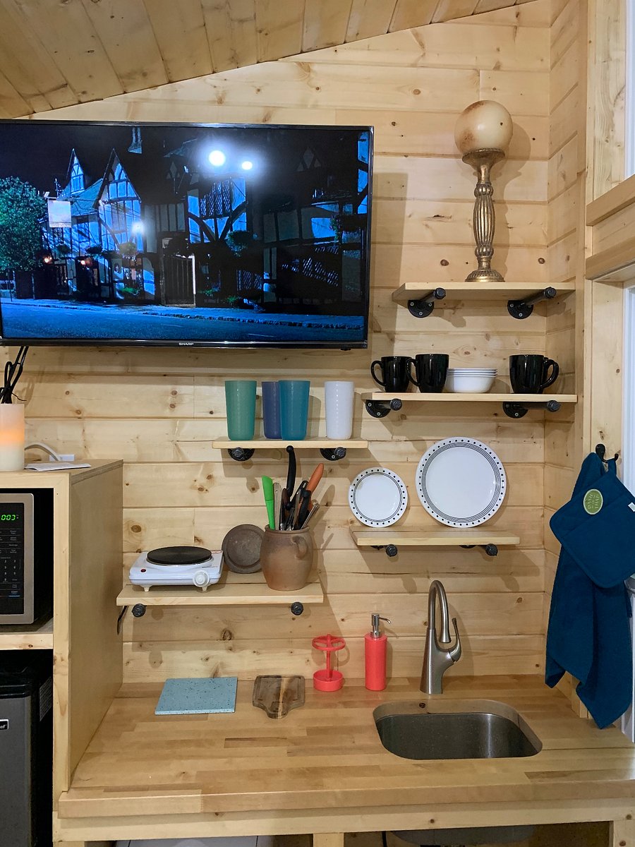 Microwave, mini oven, Fridge, camping stove top, utensils, etc.