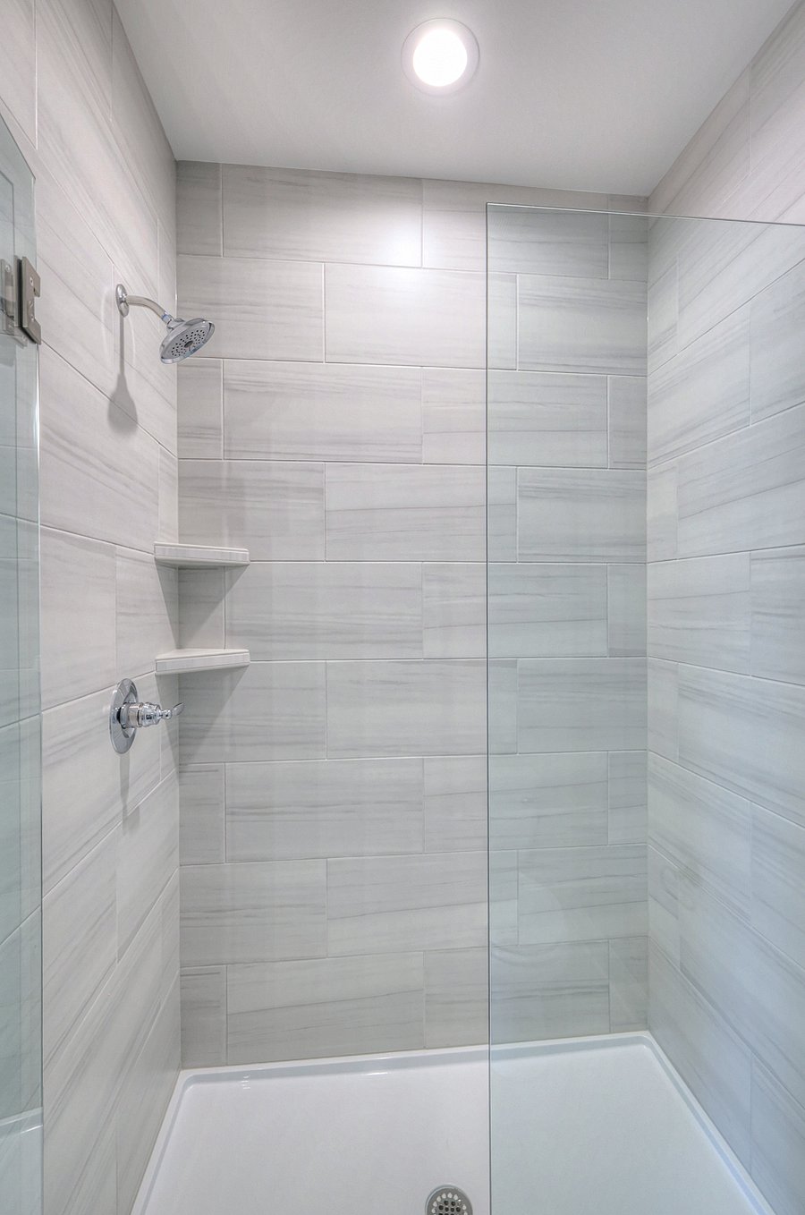 the primary suite features a walk in shower