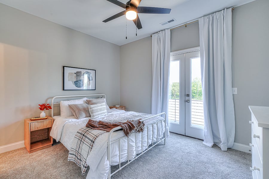 The secondary bedroom features a queen sized bed
