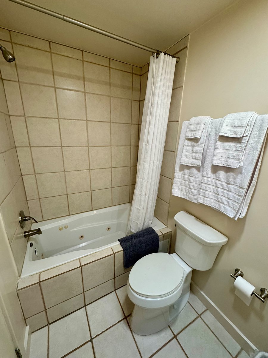 Main bathroom in the hallway between bedrooms. Both bathrooms have skylights, exhaust fans, extra towels, soap and shampoo and cleaning supplies to get you started.