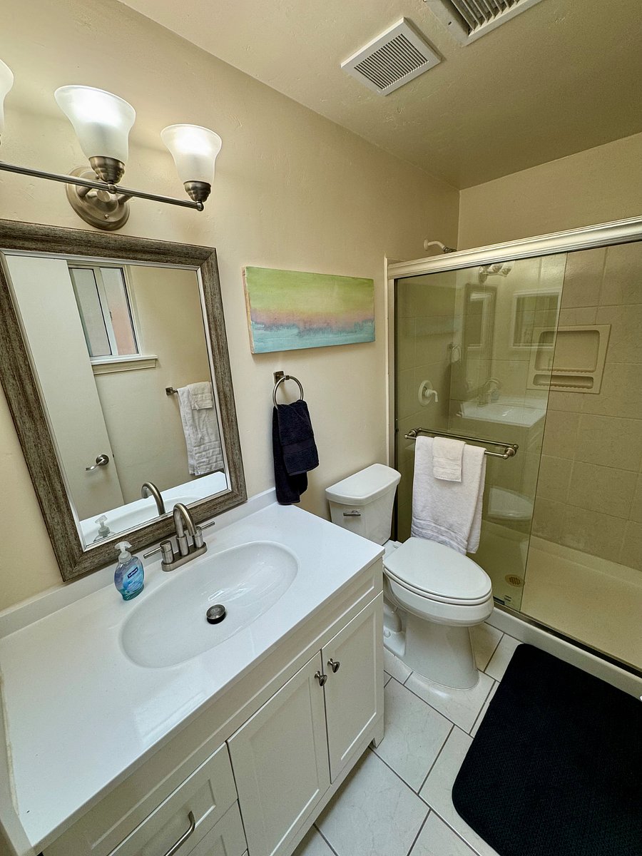 Private bathroom in the master bedroom. Both bathrooms have skylights, exhaust fans, extra towels, soap and shampoo and cleaning supplies to get you started.