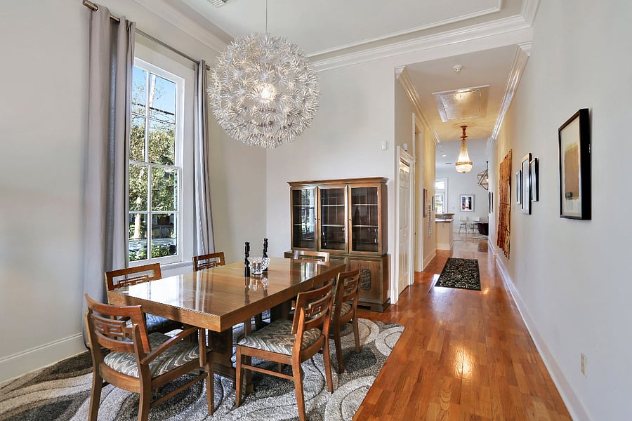 Dining area looking down hallway to kitchen and back living room.`