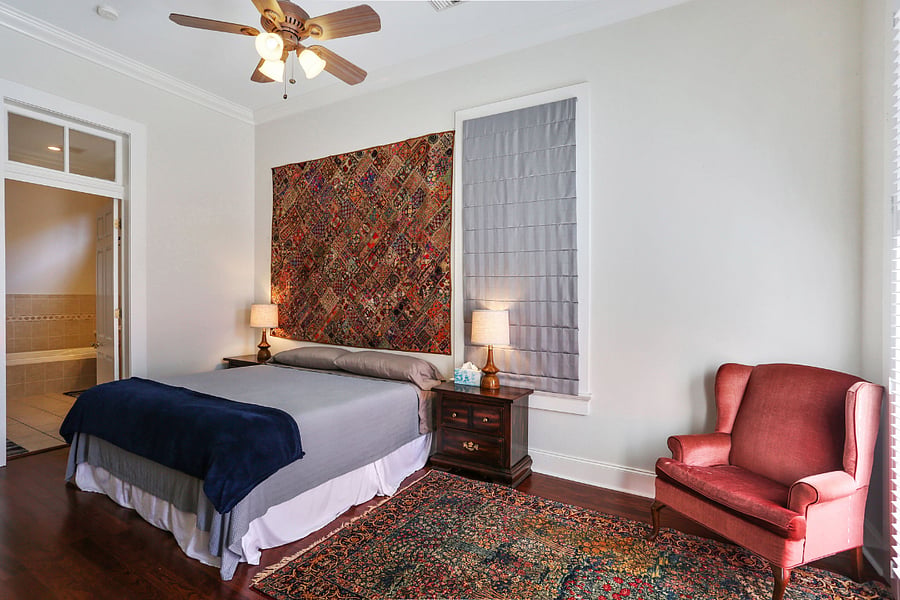 Primary bedroom with king memory foam bed and spacious full bath with bath and rain shower.