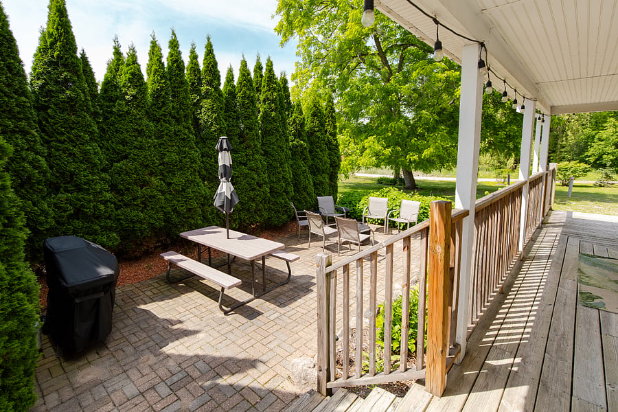 The private patio area has a grill, picnic table, and solo stove.
