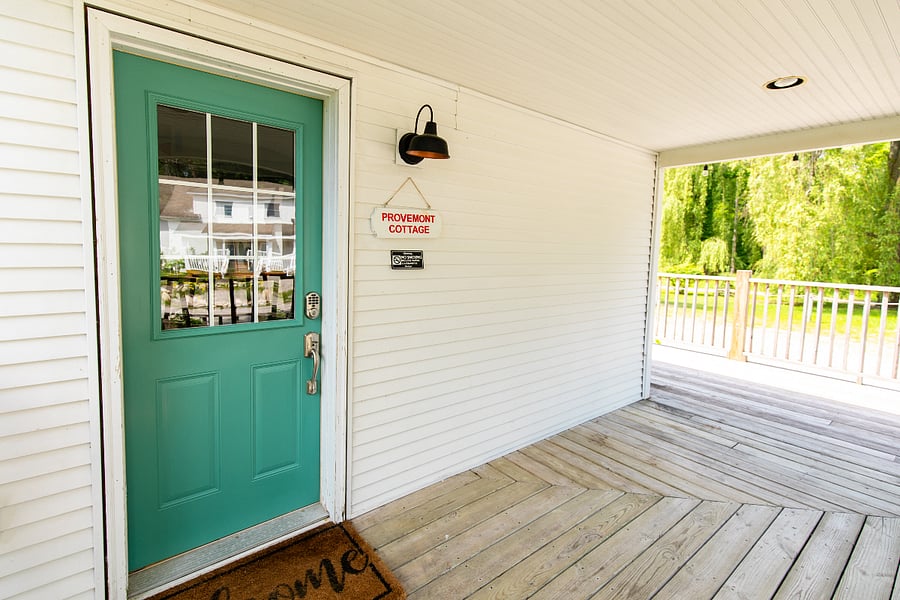 The main entrance is located on the north-facing side of the house.