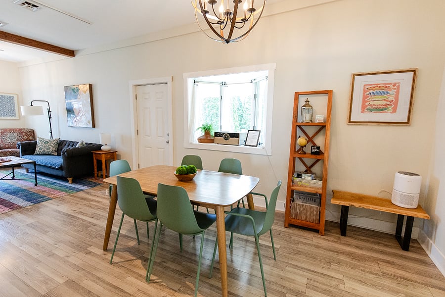 The dining area has a table with six chairs and can be easily used as a work-from-home space.