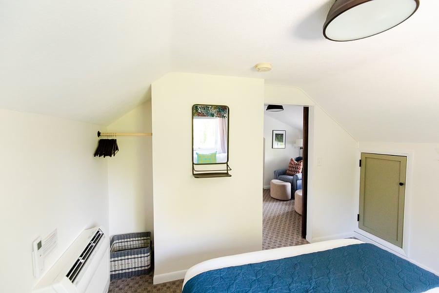 Bedroom 3 has a sliding barn door and is located off of the middle TV space.