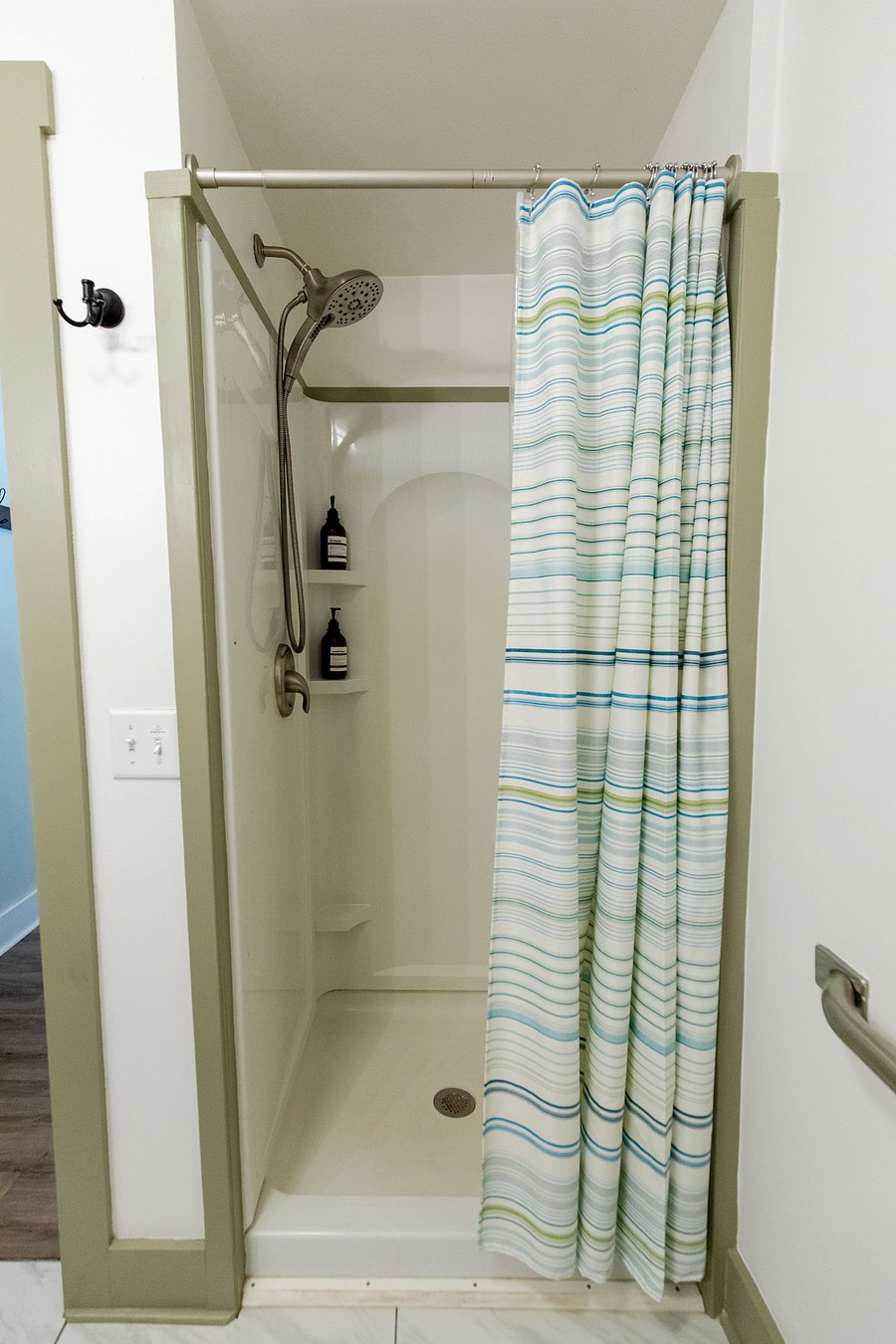 The bathroom has a walk-in shower. (Shower products are provided for STR guests).