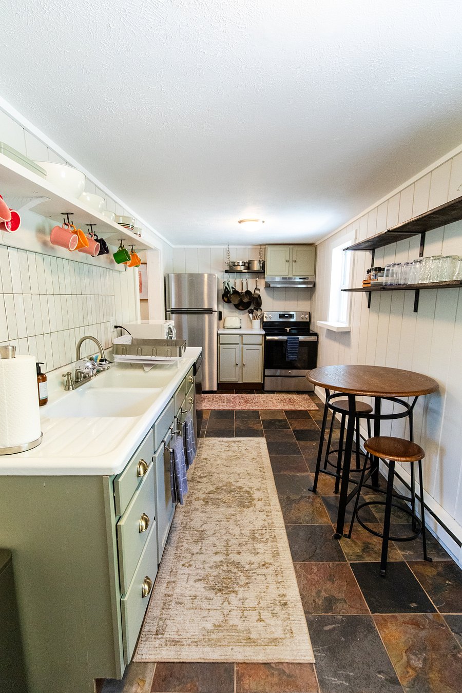 The kitchen includes a dishwasher, stove/oven, refrigerator, toaster, microwave, drip coffee pot, tea kettle, and is fully stocked with with basic cooking items.