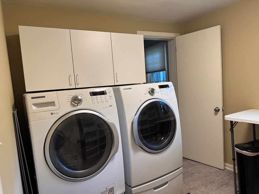 Front loading washer and dryer in large laundry room