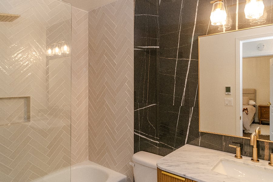 The Shared Bath:
I hate sharing a bath, but if I had to, I would want one that had my own storage space and also luxury touches. This one has enough storage and mirror space so that the Blue Room and the Ralph Lauren Room could share easily. Again, heated floors --yummy! ...and a brand new marble bathtub, shower tile and backsplash; marble makes it easier to share. Amenities: shampoo and conditioner, soap, q-tips and enough toilet paper to last you your stay.