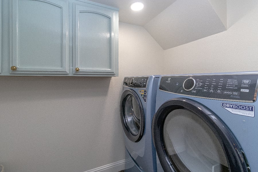 Laundry Room: Ironing Board and Steel Iron and Steam Iron stored just outside the Laundry room in the Garage Storage.
The Laundry Room is Between the kitchen and the Garage.
Detergent and Softener stored in the above cabinets - enough for your first 4 or 5 loads.