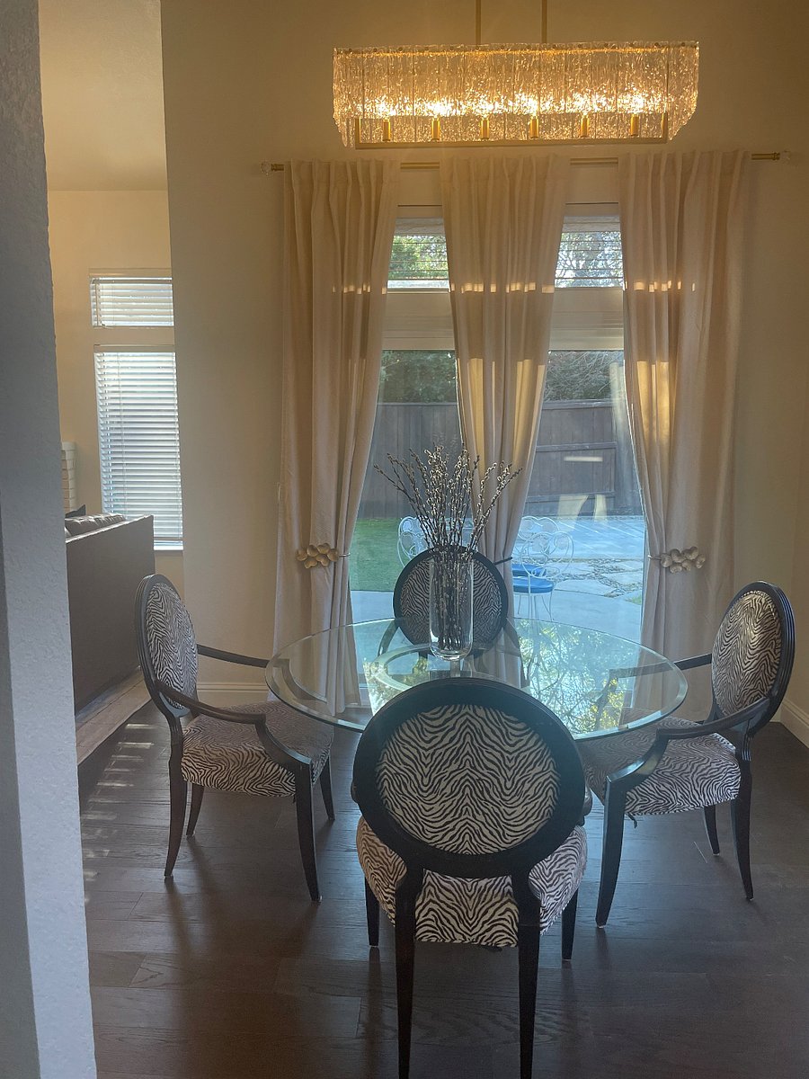 We love this dining area that allows the outside in and the inside out. Additional sitting on covered patio. Camilla's in bloom are the best backdrop to your morning coffee.