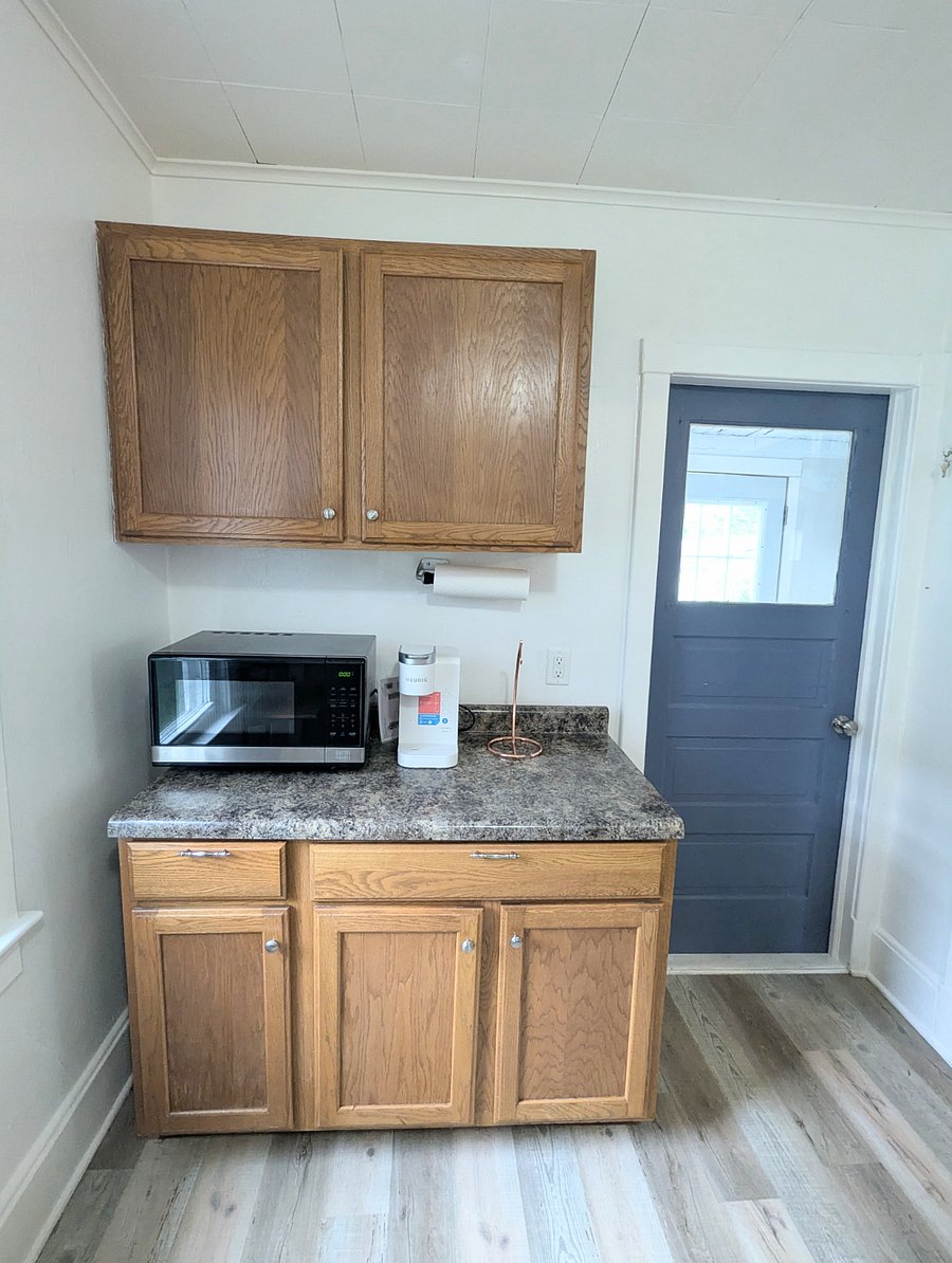 Kitchen: Microwave, Keurig, fridge, pots, pans, etc provided