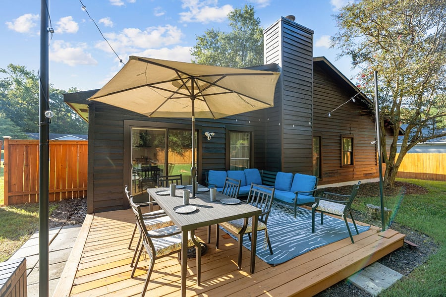 Outdoor living/dining includes ample seating