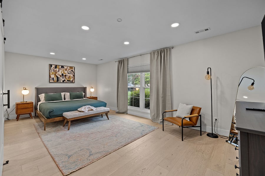 Lounge in this spacious master bdrm with en-suite bath and king bed
