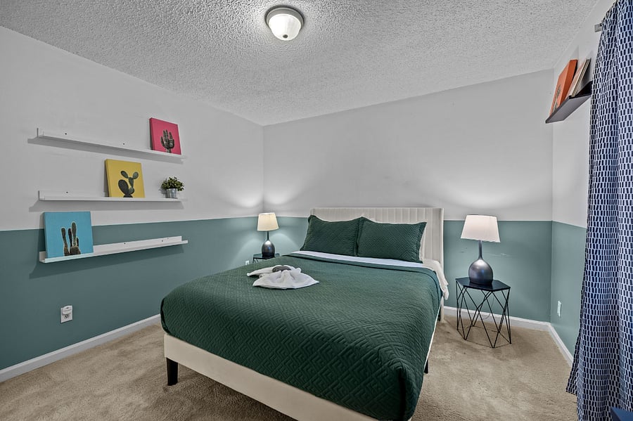 Relax in this quiet queen bedroom oasis w/workstation
