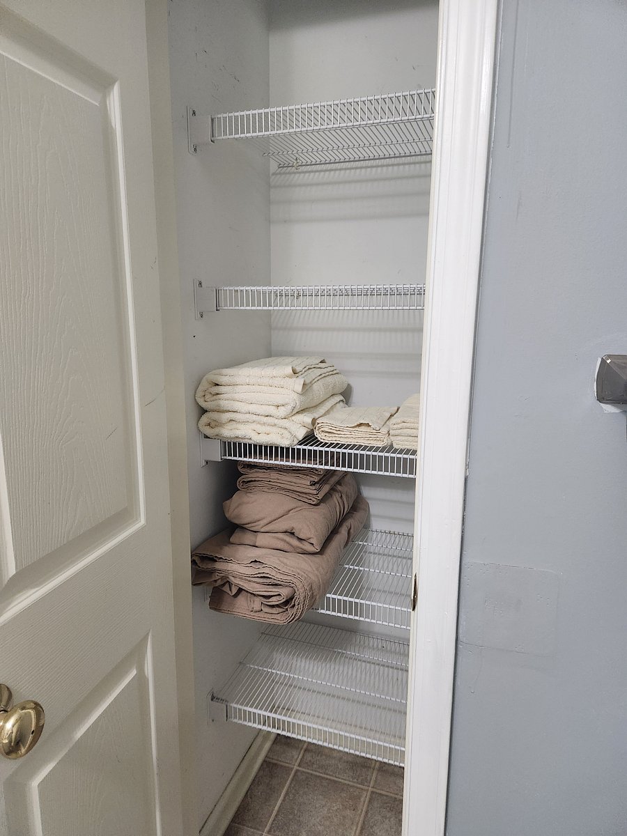Plenty of bathroom storage for toiletries and other belongings between the undersink cabinet and the bathroom closet. Set of towels and bedsheets provided