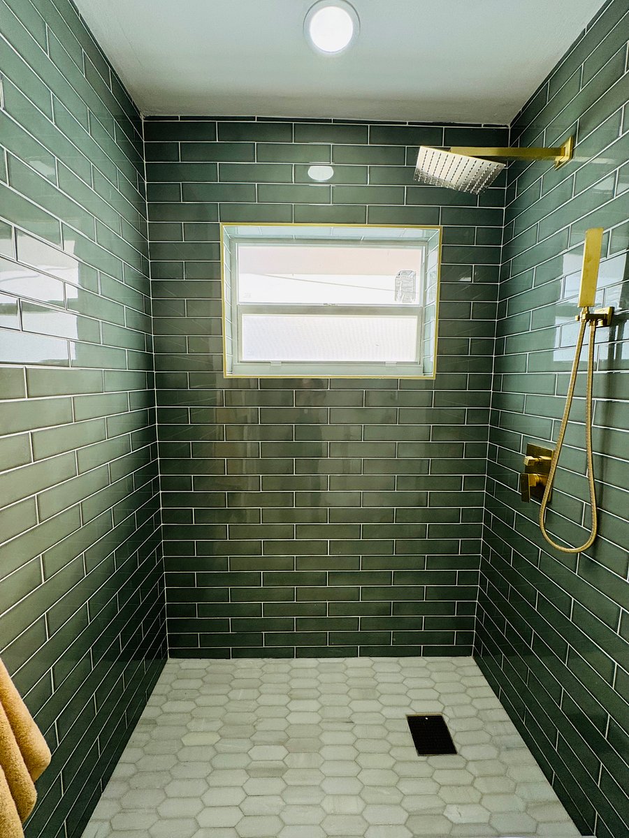 Indulge in your private en-suite bathroom with a sleek walk-in shower, modern fixtures, and elegant, spa-inspired finishes.