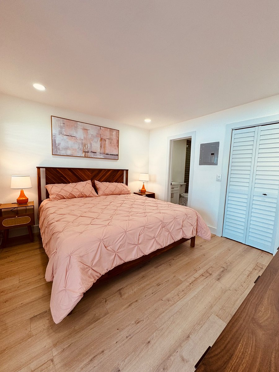 The master bedroom features a private entrance and a luxurious en-suite bathroom, creating a serene and exclusive retreat.