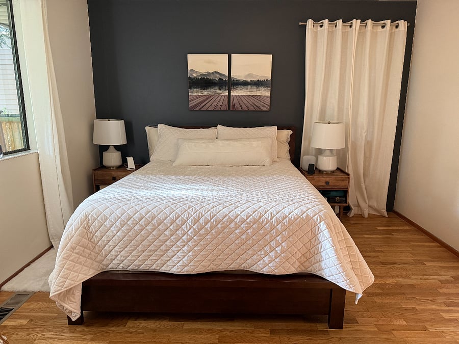 bedroom with queen bed, two closets with Elfa system, beautiful view of trees