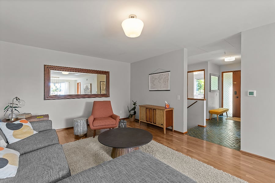 comfortable open living areas with hardwoods and rugs throughout