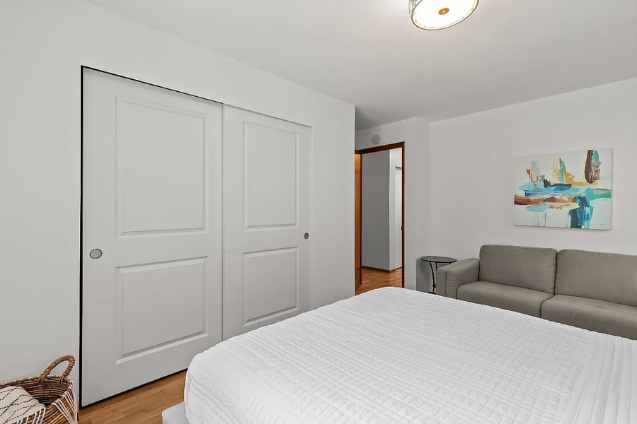 large closet extends length of room - has Elfa drawers on each side and plenty of room for hanging clothes