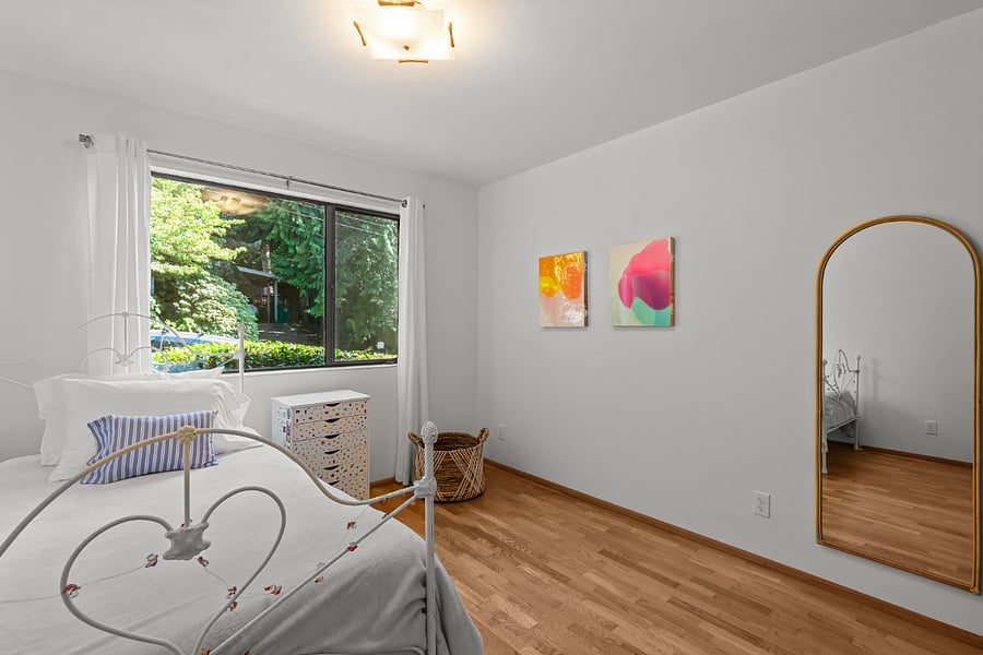bright sunny bedroom with Elfa system in closet
