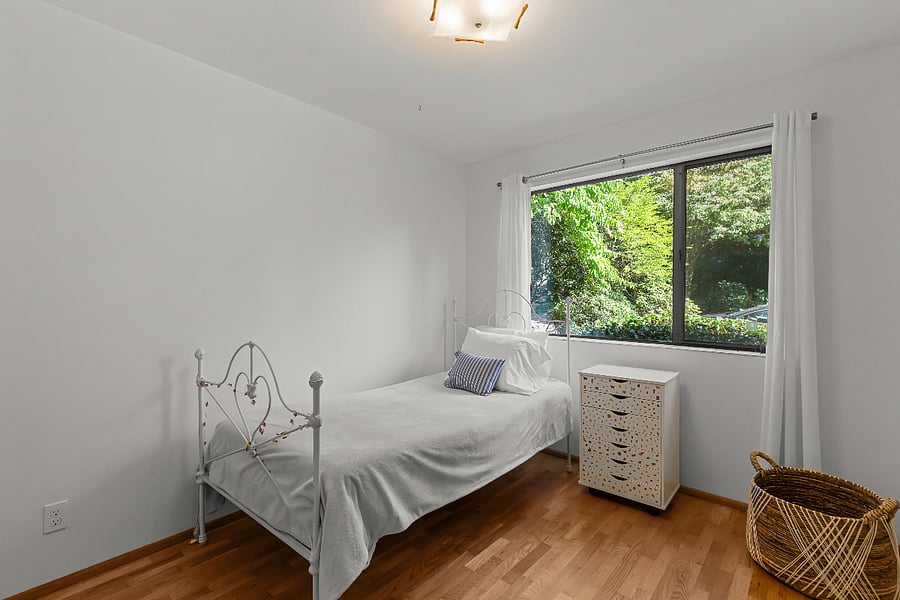 bright sunny bedroom with Elfa system in closet