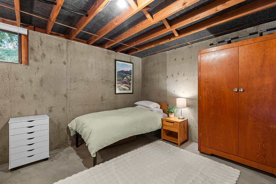 large bedroom with twin XL bed and standing desk - great for a teen