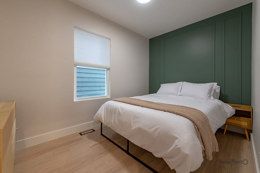 Bedroom 2 with queen size bed. Bedroom also has dresser and closet.  