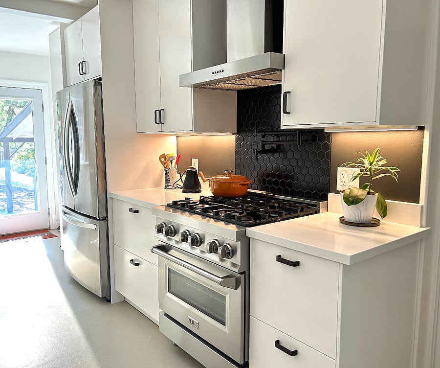 New kitchen with quartz countertops and modern appliances.
