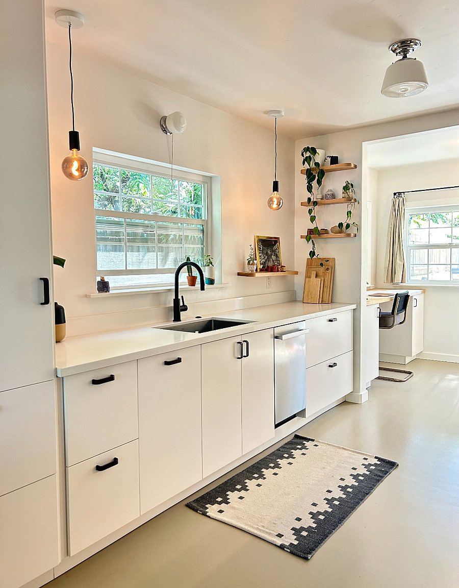 New kitchen with quartz countertops and modern appliances.