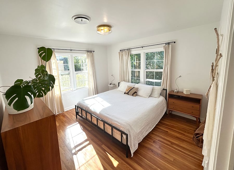 King-size Tuft & Needle bed, West Elm furniture, air purifying salt lamp, reading lights, walk-in closet.