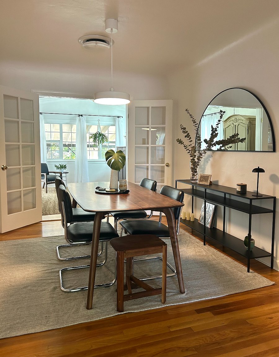 Castlery dining table with leather chairs.