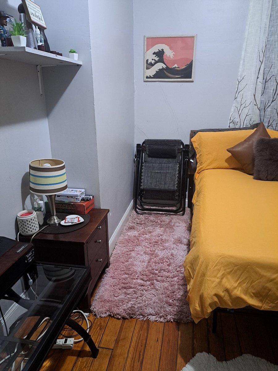 Private room with double bed and lazy chair